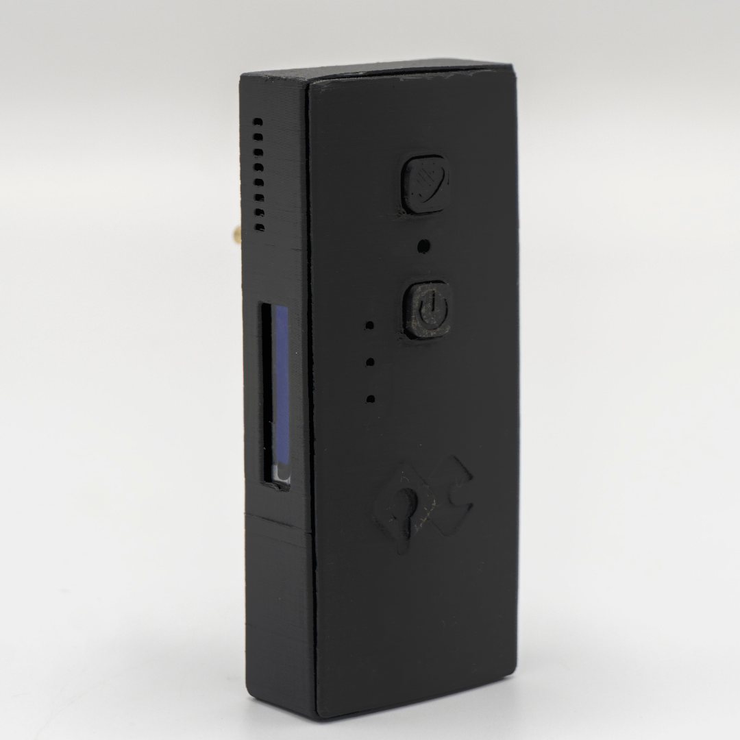 The QuickComm Bridge Node standing upright: status display, two control buttons and the QuickComm mark on the front