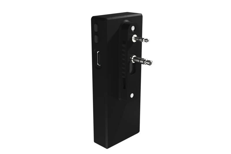 QuickComm Bridge Node rear view showing the belt clip and dual audio plugs