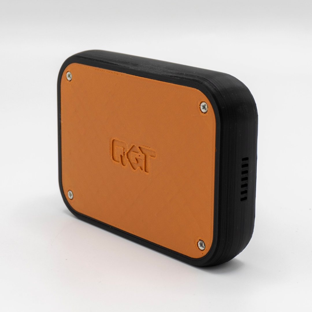 The orange panel of the QuickComm Table Top with the embossed QuickComm mark and corner screws